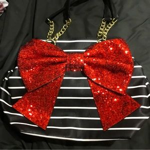 Black and white striped Betsy Johnson bag with large sequinned bow